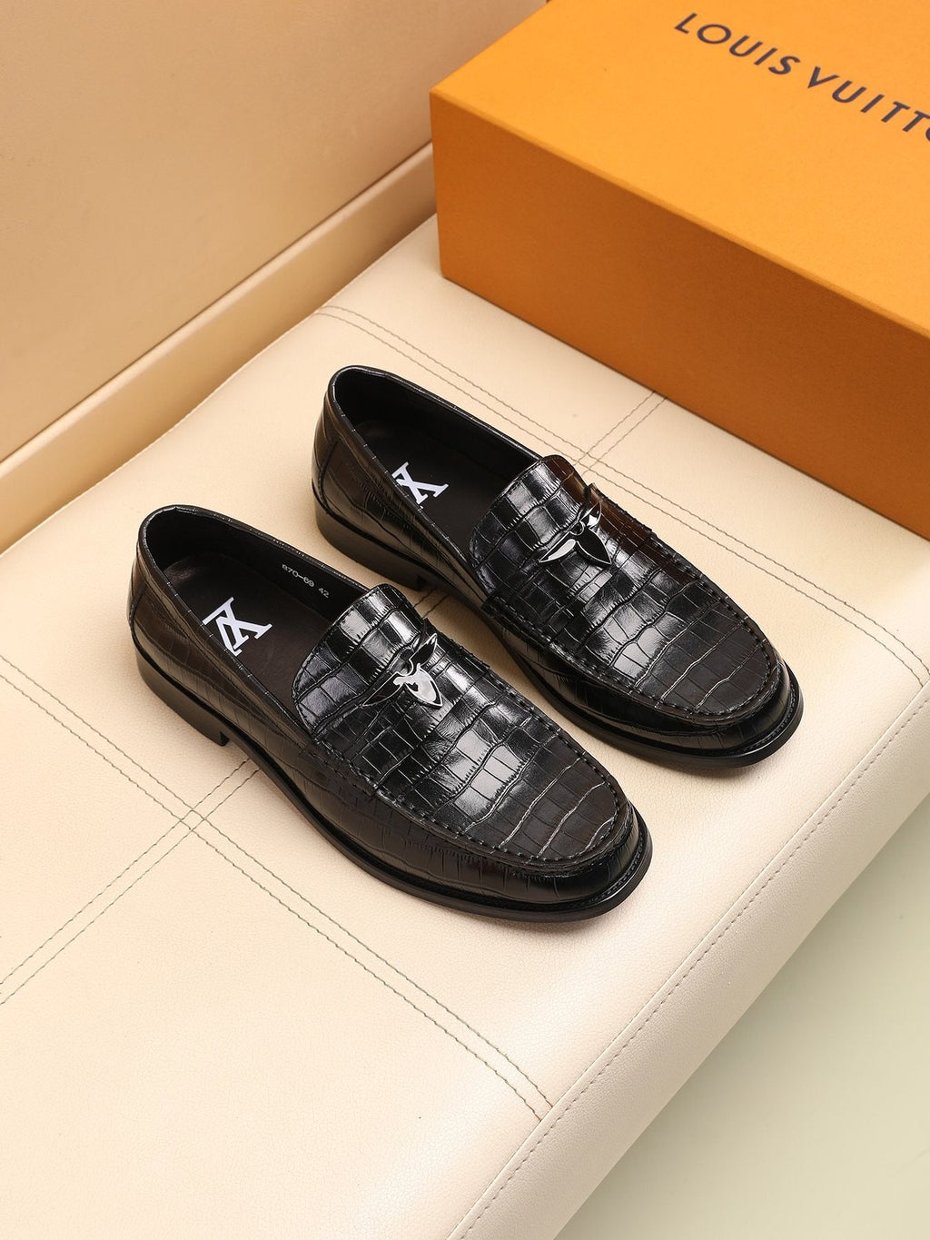 Louis Vuitton Embossed Strap Loafers — model